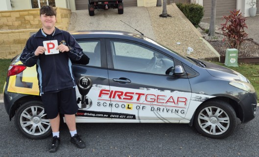Alfie Harcom celebrating passing their driving test