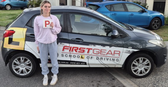 Decoda T celebrating passing their driving test