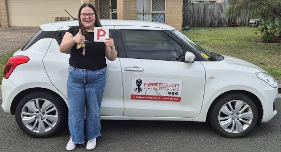 Olivia Hartnett celebrating passing their driving test